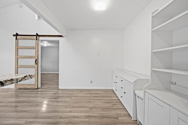 2920 Briarwood Rd Unit G12, Bonita, CA 91902 - spacious closet with a barn door and light wood-style floors