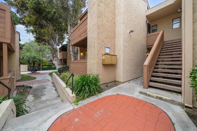 2920 Briarwood Rd Unit G12, Bonita, CA 91902 - view of property exterior featuring stairs and stucco siding