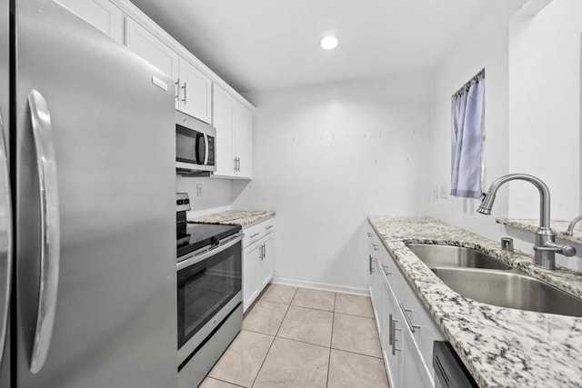 2920 Briarwood Rd Unit G12, Bonita, CA 91902 - kitchen featuring appliances with stainless steel finishes, a sink, light stone counters, white cabinetry, and recessed lighting