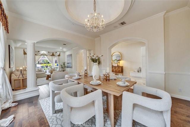 1768 Oakwood Ave, Arcadia, CA 91006 - dining area featuring arched walkways, a tray ceiling, dark wood-style flooring, a chandelier, and crown molding
