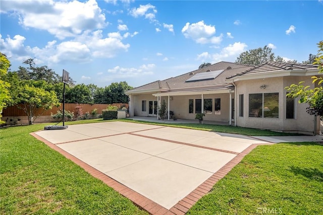 1768 Oakwood Ave, Arcadia, CA 91006 - rear view of house with a tiled roof, stucco siding, a patio area, and roof mounted solar panels