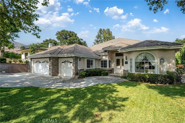 1768 Oakwood Ave, Arcadia, CA 91006 - ranch-style home with stucco siding, a tile roof, an attached garage, driveway, and a front yard