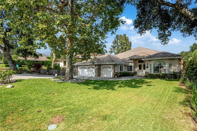 1768 Oakwood Ave, Arcadia, CA 91006 - view of front of house with a garage, a front lawn, stucco siding, and driveway