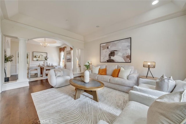 1768 Oakwood Ave, Arcadia, CA 91006 - living area featuring decorative columns, arched walkways, a tray ceiling, hardwood / wood-style flooring, and crown molding