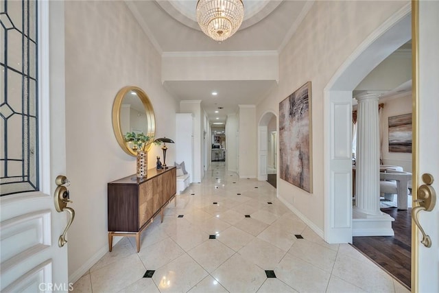 1768 Oakwood Ave, Arcadia, CA 91006 - foyer entrance featuring arched walkways, light tile patterned floors, baseboards, ornate columns, and crown molding