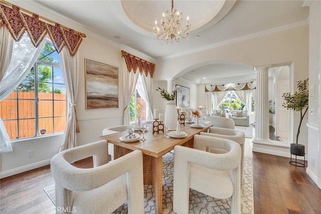 1768 Oakwood Ave, Arcadia, CA 91006 - dining area with arched walkways, hardwood / wood-style floors, healthy amount of natural light, and crown molding
