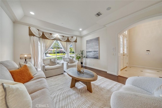 1768 Oakwood Ave, Arcadia, CA 91006 - living area featuring arched walkways, plenty of natural light, wood finished floors, baseboards, and ornamental molding