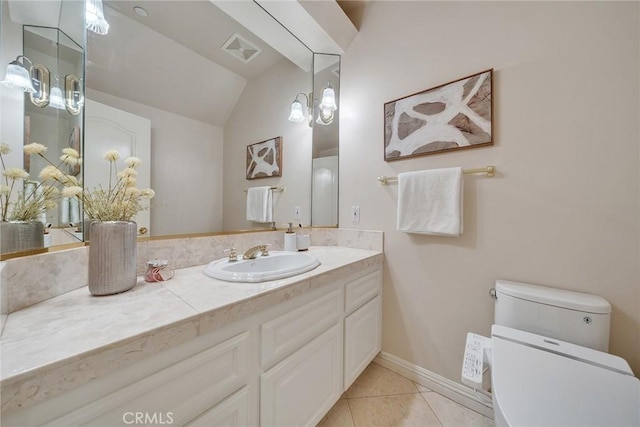 1768 Oakwood Ave, Arcadia, CA 91006 - bathroom featuring toilet, lofted ceiling, vanity, tile patterned floors, and baseboards