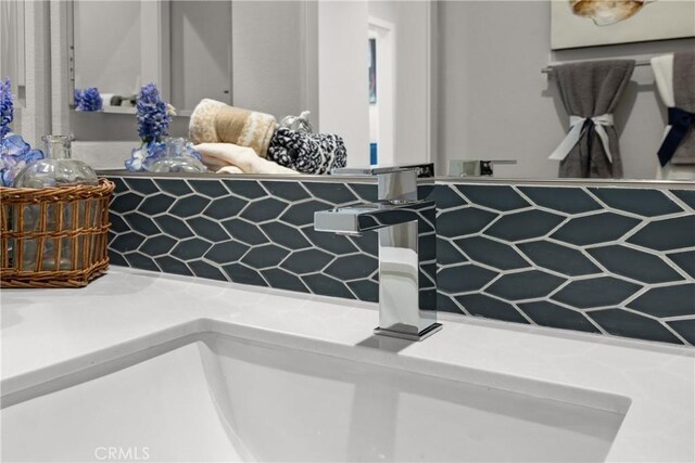 13897 Mesa View Dr, Victorville, CA 92392 - bathroom view of a sink and decorative backsplash