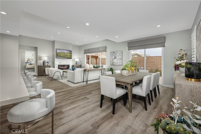 13897 Mesa View Dr, Victorville, CA 92392 - dining space featuring a high end fireplace, light wood-style flooring, recessed lighting, and baseboards