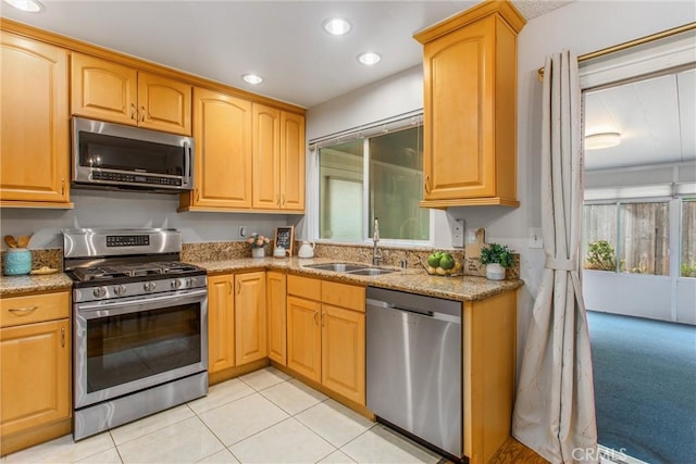 366 Elderberry St, La Verne, CA 91750 - kitchen with stainless steel appliances, a sink, light stone counters, light tile patterned flooring, and recessed lighting