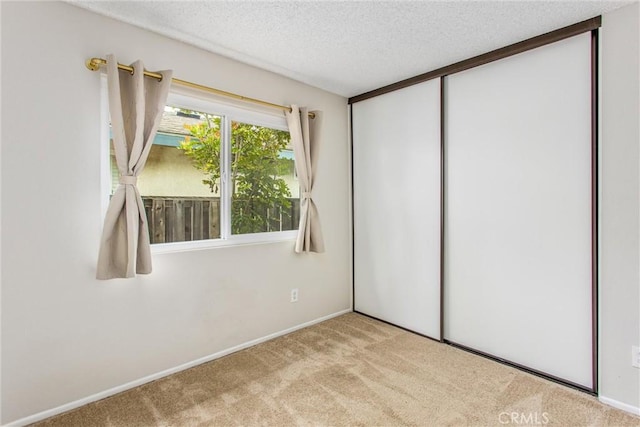 366 Elderberry St, La Verne, CA 91750 - unfurnished bedroom featuring carpet, a textured ceiling, baseboards, and a closet