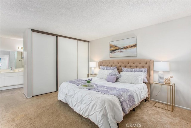 366 Elderberry St, La Verne, CA 91750 - bedroom with light colored carpet, a textured ceiling, connected bathroom, and baseboards
