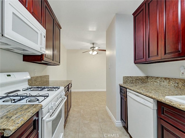 8990 19th St Unit 426, Rancho Cucamonga, CA 91701 - kitchen with white appliances, dark brown cabinets, ceiling fan, light tile patterned floors, and light stone counters