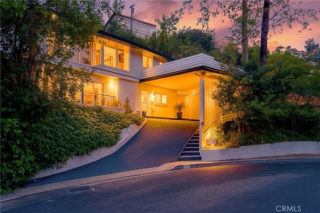 3839 Davana Rd, Sherman Oaks, CA 91423 - modern home with driveway and an attached carport