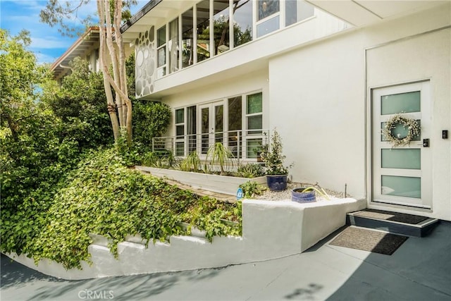 3839 Davana Rd, Sherman Oaks, CA 91423 - view of property exterior with stucco siding and french doors
