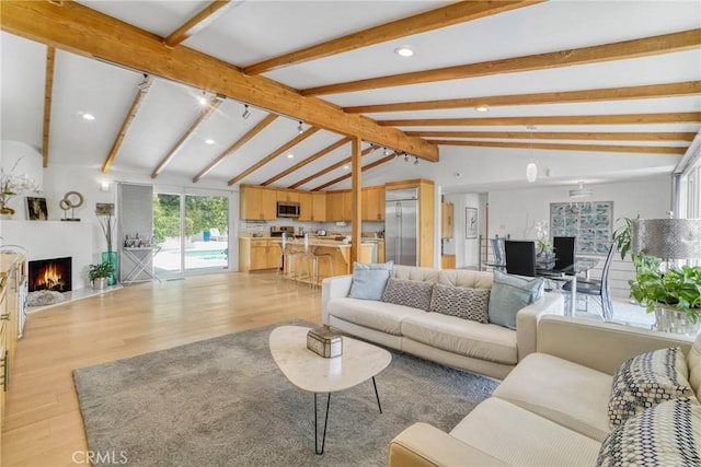 3839 Davana Rd, Sherman Oaks, CA 91423 - living area featuring light wood-style floors, a warm lit fireplace, and recessed lighting