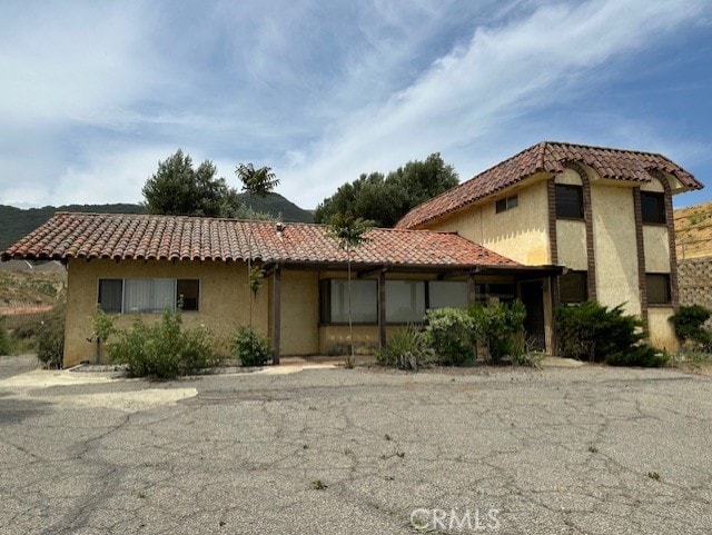 28450 6th St, Temecula, CA 92590 - view of front facade with a tiled roof and stucco siding