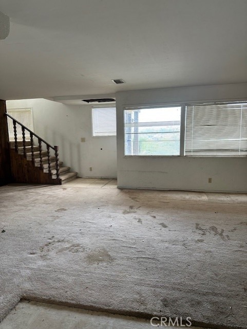 28450 6th St, Temecula, CA 92590 - carpeted empty room with stairway