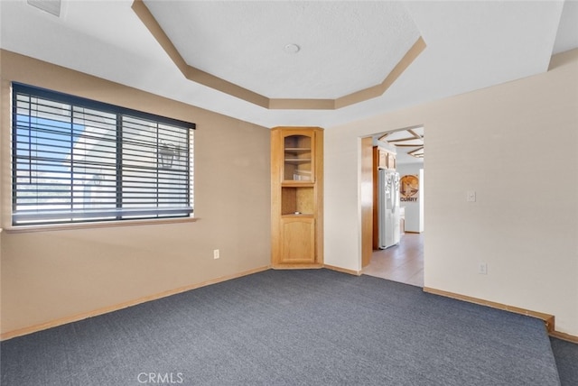 16635 Wintun Rd, Apple Valley, CA 92307 - carpeted empty room featuring baseboards and a raised ceiling