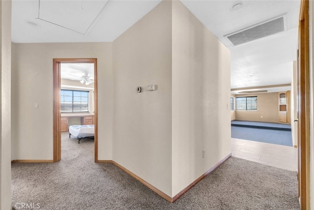 16635 Wintun Rd, Apple Valley, CA 92307 - hallway featuring carpet floors, baseboards, attic access, and plenty of natural light