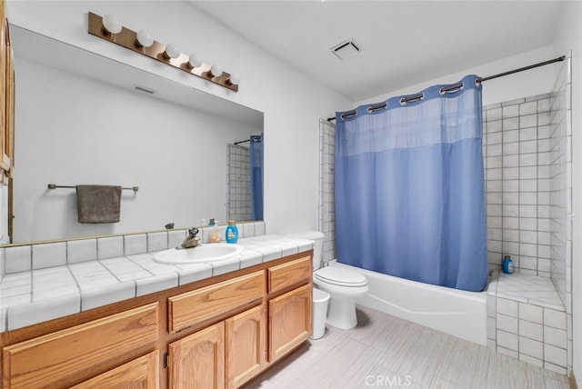 16635 Wintun Rd, Apple Valley, CA 92307 - full bathroom with vanity, toilet, shower / tub combo, tile patterned floors, and a bidet