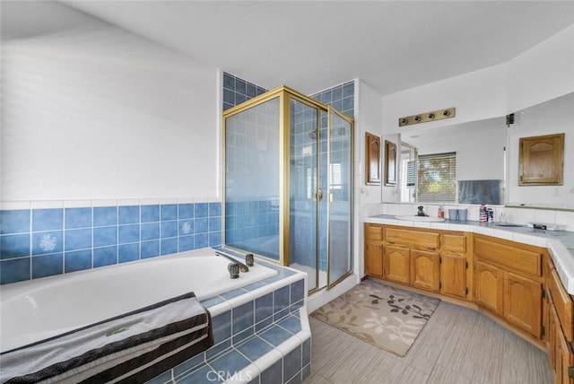 16635 Wintun Rd, Apple Valley, CA 92307 - full bath featuring a garden tub, vanity, a shower stall, and tile patterned flooring