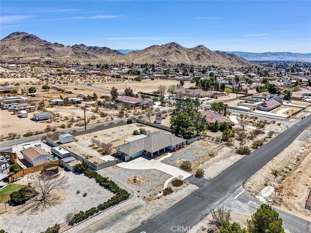 16635 Wintun Rd, Apple Valley, CA 92307 - aerial perspective of suburban area with a mountain backdrop and a desert landscape