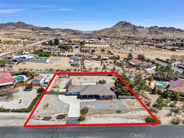 16635 Wintun Rd, Apple Valley, CA 92307 - aerial perspective of suburban area with property parcel outlined, a mountainous background, and a desert landscape