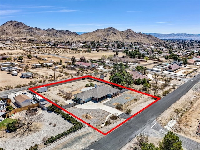 16635 Wintun Rd, Apple Valley, CA 92307 - aerial view of residential area featuring mountains, property parcel outlined, and a desert landscape
