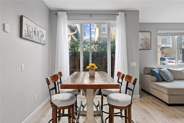 341 W Pebble Creek Ln, Orange, CA 92865 - dining area with plenty of natural light, light wood-style flooring, and baseboards