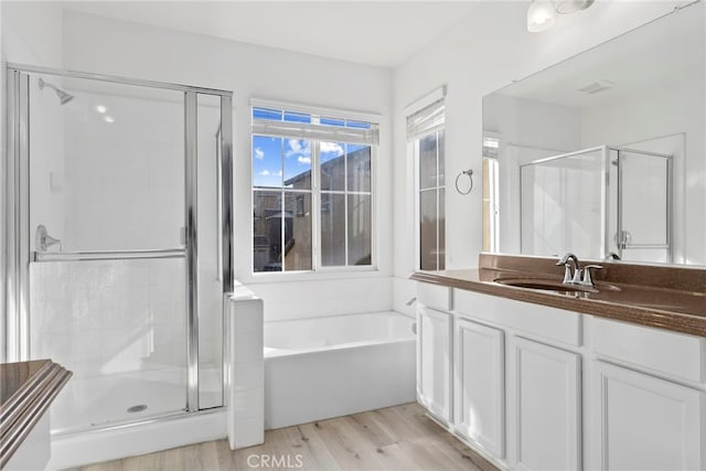 341 W Pebble Creek Ln, Orange, CA 92865 - full bathroom with a shower stall, vanity, a bath, and wood finished floors