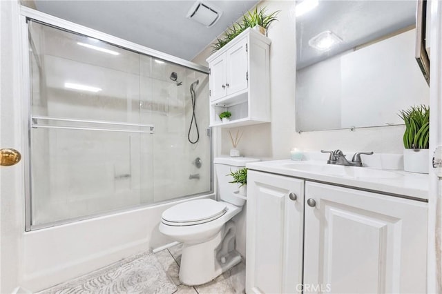 9038 Orion Ave Unit 107, North Hills, CA 91343 - full bathroom featuring toilet, vanity, enclosed tub / shower combo, and tile patterned floors