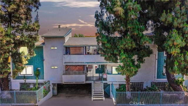 9038 Orion Ave Unit 107, North Hills, CA 91343 - property at dusk with stairs and a carport