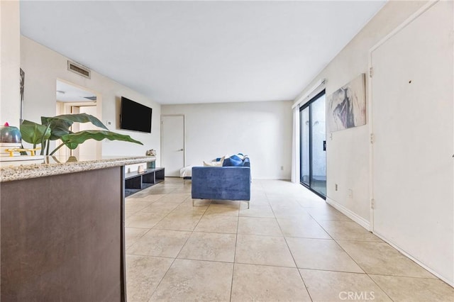9038 Orion Ave Unit 107, North Hills, CA 91343 - living room with light tile patterned floors