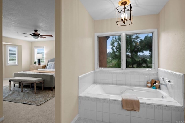 4036 Stonebridge Ln, Rancho Santa Fe, CA 92091 - bathroom with a bath, a chandelier, a ceiling fan, and baseboards