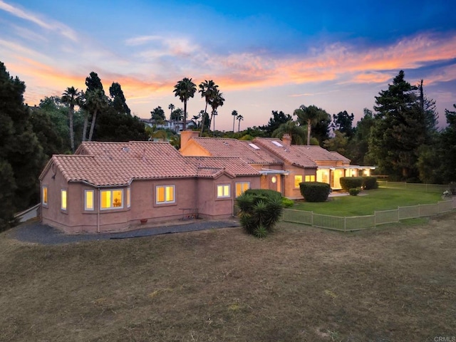 4036 Stonebridge Ln, Rancho Santa Fe, CA 92091 - back of property at dusk featuring a tile roof and stucco siding