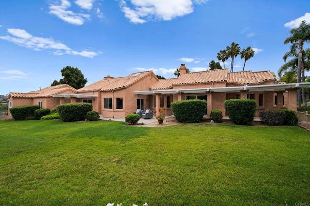 4036 Stonebridge Ln, Rancho Santa Fe, CA 92091 - back of house featuring a chimney, stucco siding, a patio, a tile roof, and a lawn