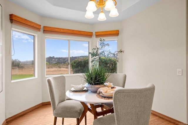4036 Stonebridge Ln, Rancho Santa Fe, CA 92091 - dining space featuring a chandelier, light wood finished floors, and baseboards
