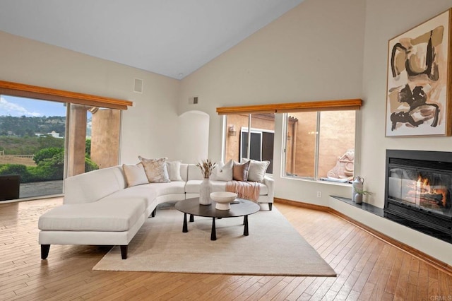 4036 Stonebridge Ln, Rancho Santa Fe, CA 92091 - living area with high vaulted ceiling, wood-type flooring, and healthy amount of natural light