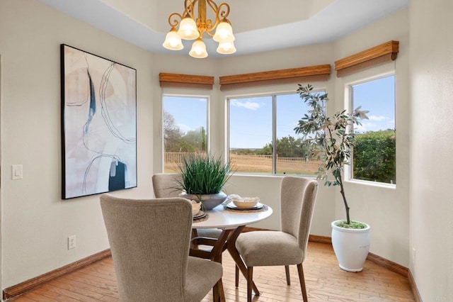 4036 Stonebridge Ln, Rancho Santa Fe, CA 92091 - dining room with light wood-style flooring, a chandelier, and baseboards