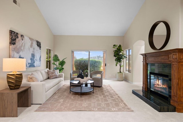 4036 Stonebridge Ln, Rancho Santa Fe, CA 92091 - living room with high vaulted ceiling, carpet flooring, a tile fireplace, and baseboards