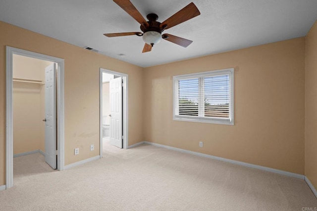 4036 Stonebridge Ln, Rancho Santa Fe, CA 92091 - unfurnished bedroom with baseboards, a walk in closet, light colored carpet, and a closet