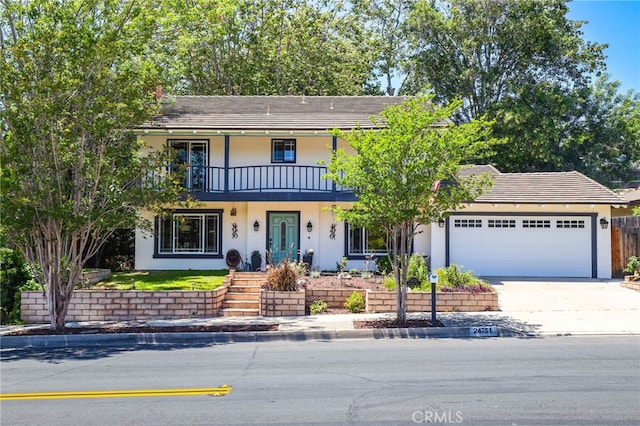 24751 Mosquero Ln, Mission Viejo, CA 92691 - view of front of property with a balcony, stucco siding, a garage, and driveway