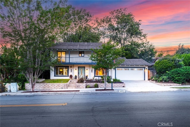 24751 Mosquero Ln, Mission Viejo, CA 92691 - traditional-style home featuring an attached garage, a balcony, driveway, and stucco siding