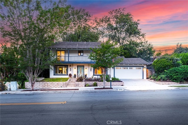 24751 Mosquero Ln, Mission Viejo, CA 92691 - traditional-style home with an attached garage, a balcony, driveway, and stucco siding