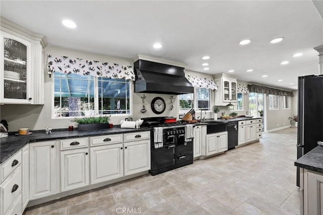 24751 Mosquero Ln, Mission Viejo, CA 92691 - kitchen featuring black appliances, premium range hood, a sink, dark countertops, and recessed lighting
