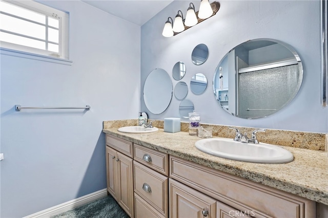 24751 Mosquero Ln, Mission Viejo, CA 92691 - bathroom featuring double vanity, a shower with shower door, and baseboards