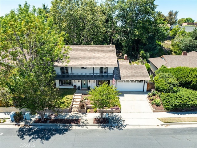 24751 Mosquero Ln, Mission Viejo, CA 92691 - traditional-style home with driveway, an attached garage, stucco siding, and a balcony