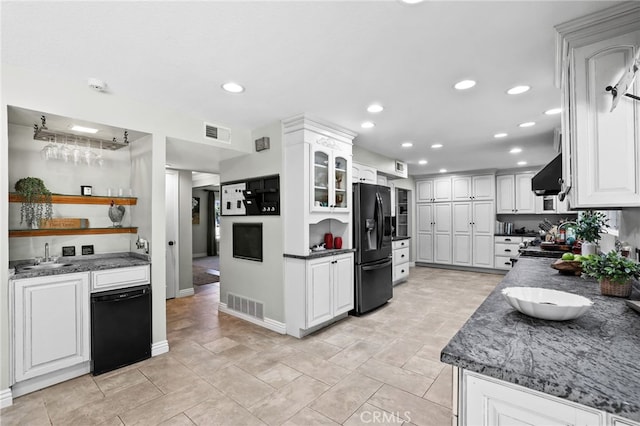 24751 Mosquero Ln, Mission Viejo, CA 92691 - kitchen with black appliances, white cabinetry, wall chimney exhaust hood, a sink, and recessed lighting